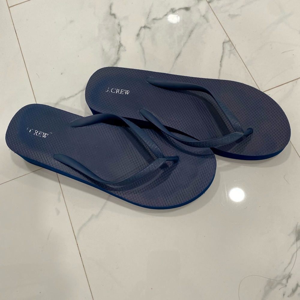 J. Crew Navy Flip Flops pre owned but in great condition.